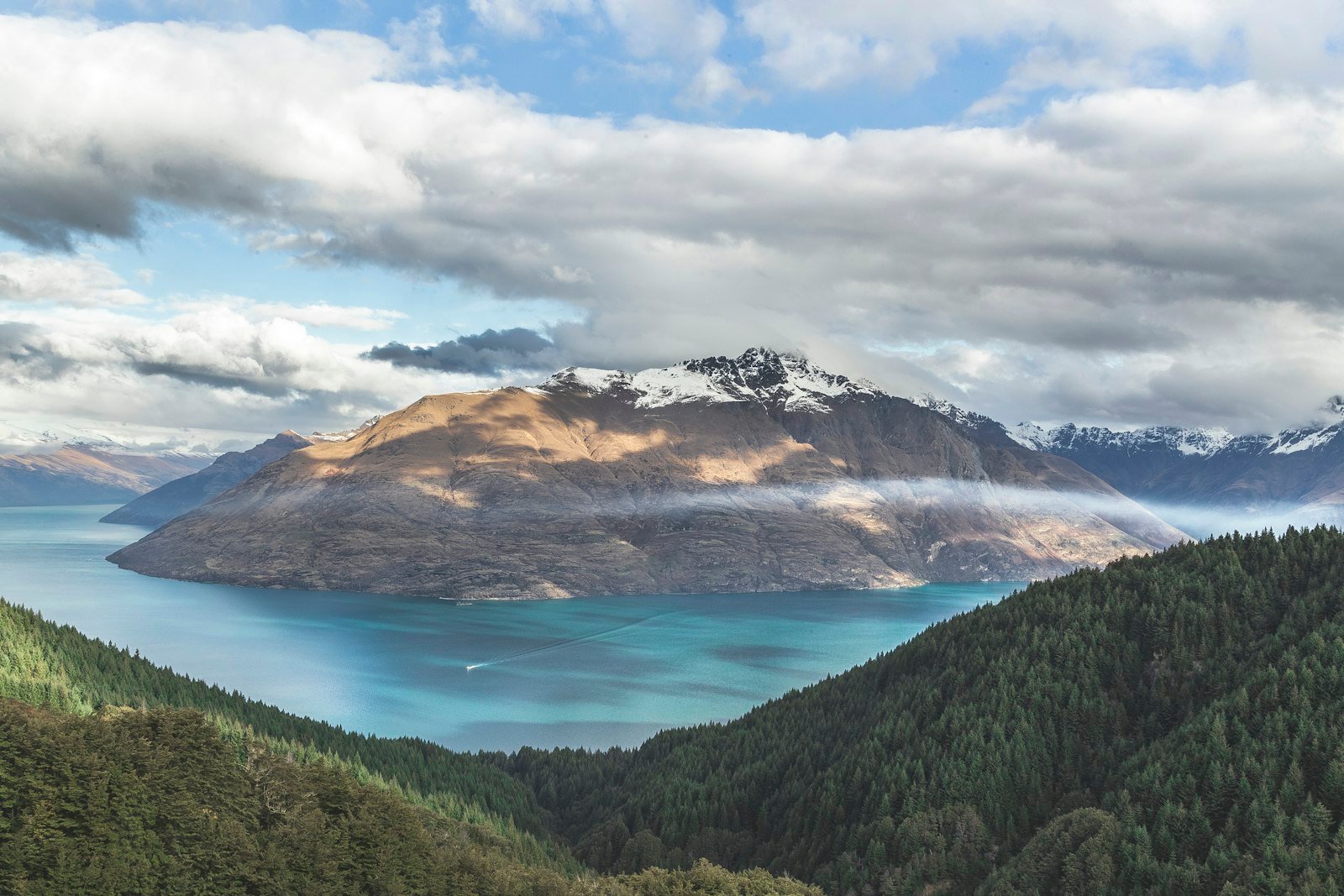 Mist drifting over the fiord walls of Milford Sound, Fiordland